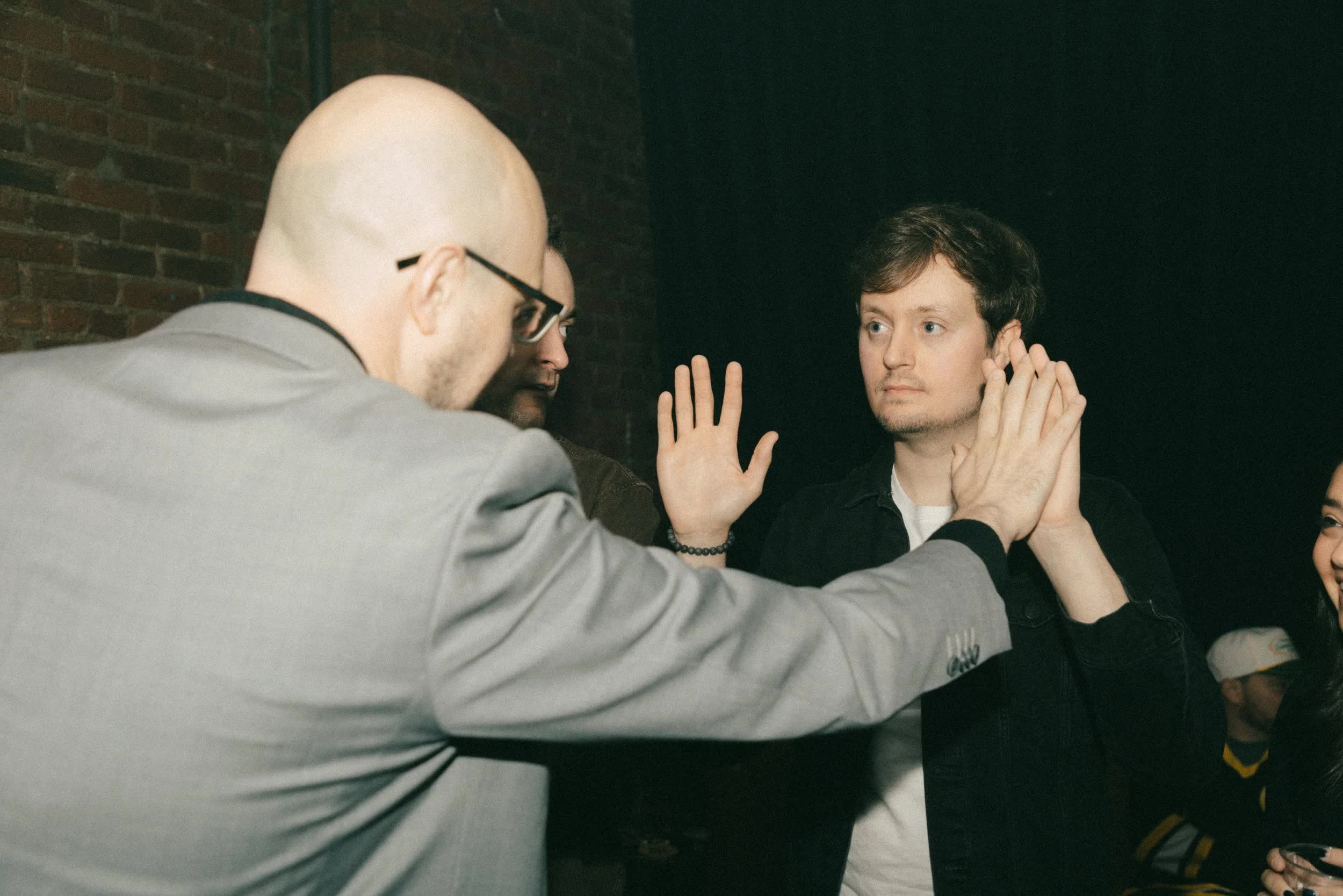 Seth Dale performing comedy magic and mentalism for an adult event audience