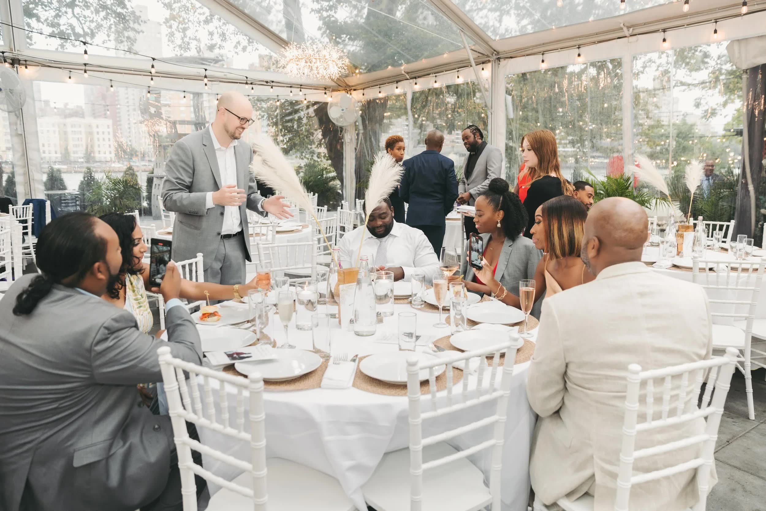 Seth Dale entertaining wedding guests with close-up magic during a reception